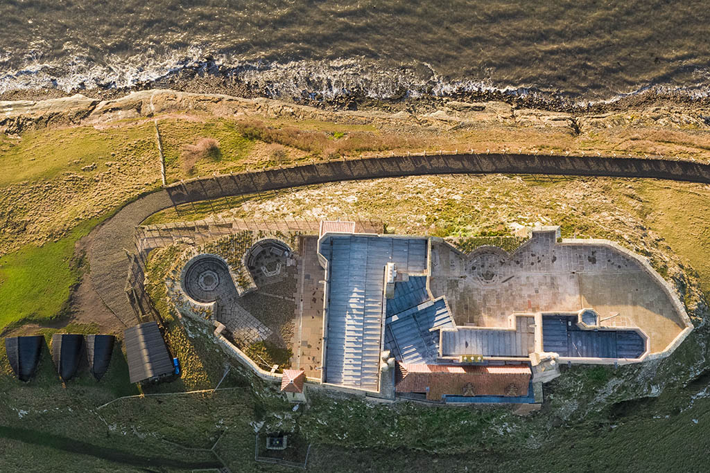 Drone photography Holy Island, Lindisfarne Castle straight down by drone operator. National Trust approved