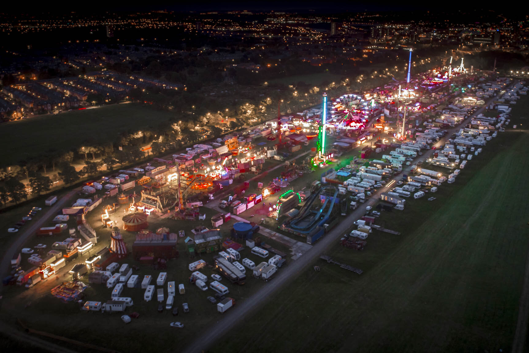 Largest travelling fair seen by drone. Night aerial photography